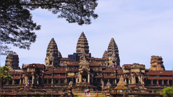 Angkor Wat reflecting in the water at sunrise.