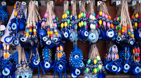 Newborn baby wearing an Evil Eye bracelet.