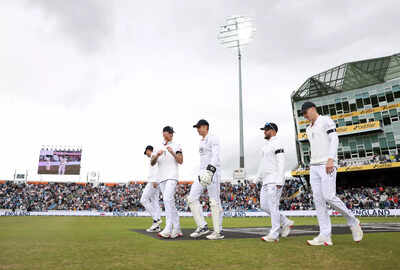 England's captain leads his team onto the field