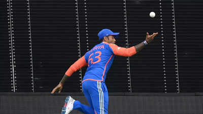 Umpires discuss rule changes during a cricket match.