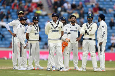 Indian team strategizing during a break in play.