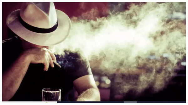 Cigarettes and glass of alcohol